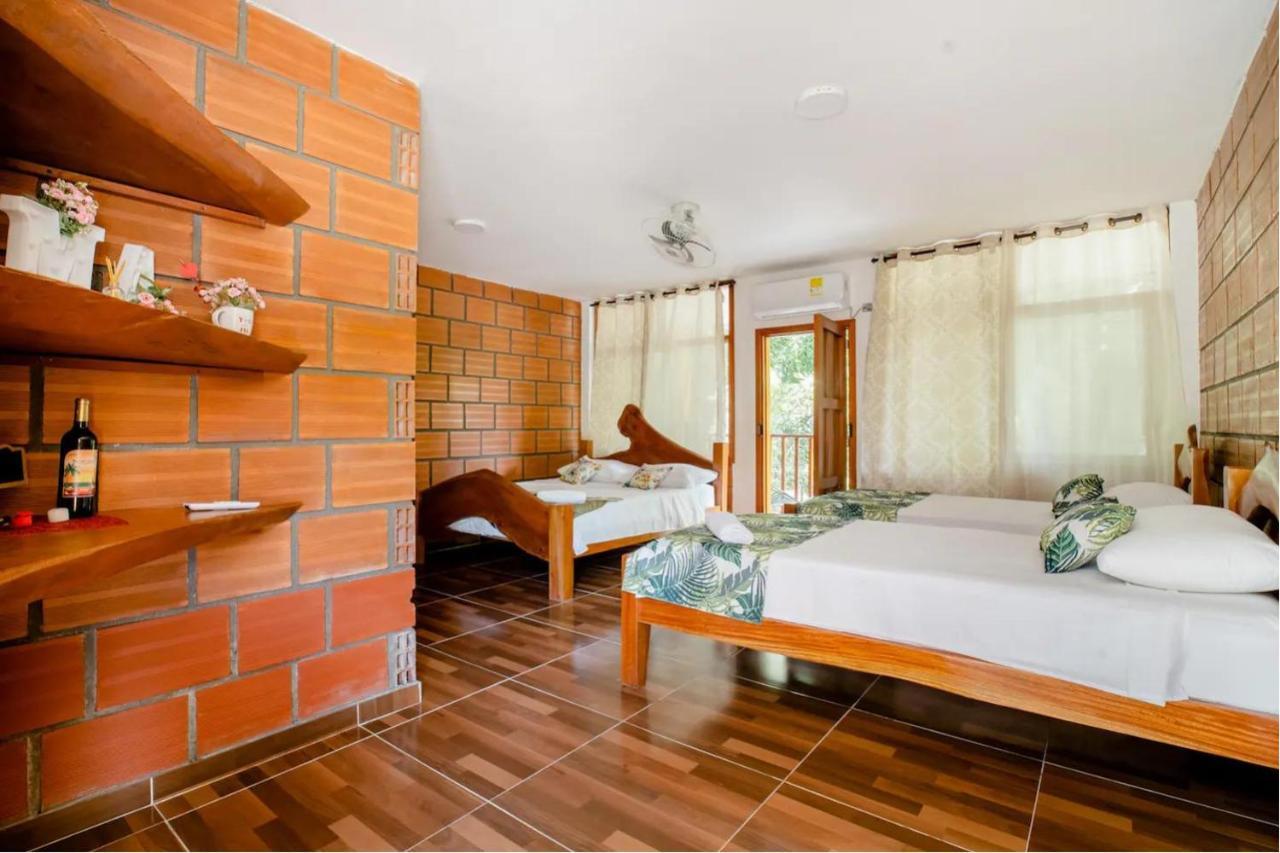 Arca Tayrona Restaurant & Hostal Los Naranjos Exterior photo